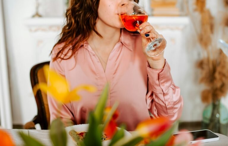 woman drinking a cocktail